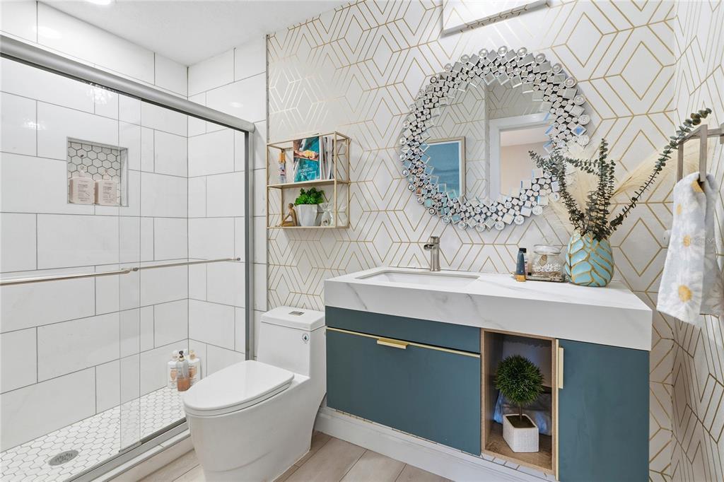 824 South Rome Avenue Tampa, FL 33606 - Photo 36 of 45 a bathroom with a sink a toilet and shower