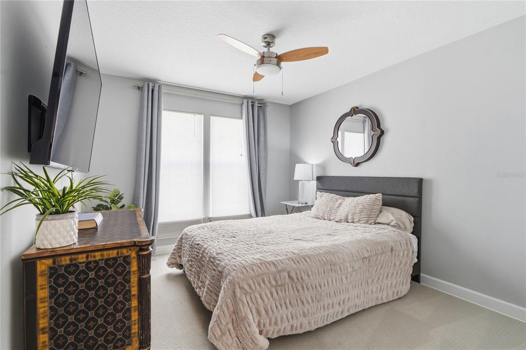 824 South Rome Avenue Tampa, FL 33606 - Photo 38 of 45 a bedroom with a bed and a chandelier