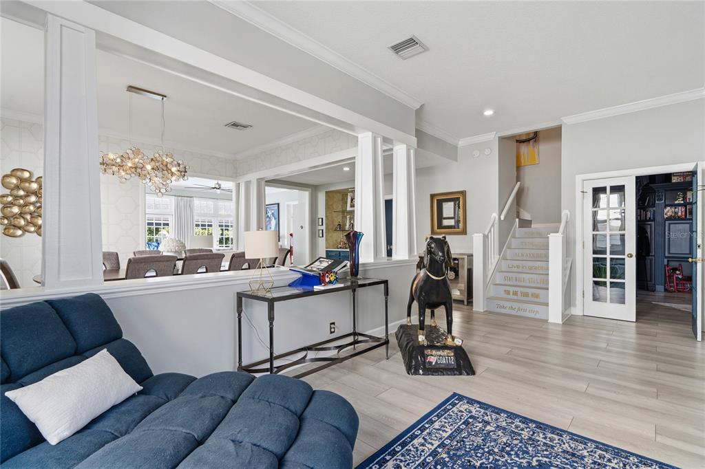 824 South Rome Avenue Tampa, FL 33606 - Photo 9 of 45 a living room with furniture a wooden floor and next to a window