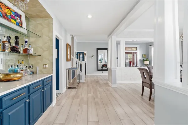 a large kitchen with lots of counter top space and stainless steel appliances