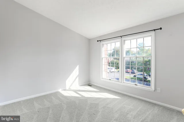 a view of a room with a large window