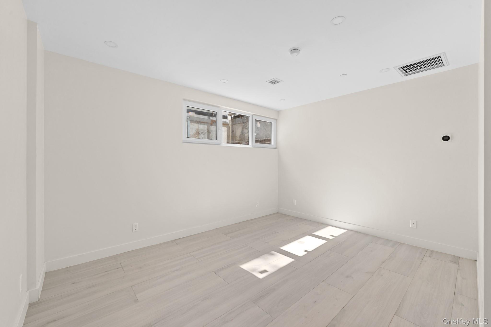 310 Fenimore Street, Unit 1 Brooklyn, NY 11225 - Photo 12 of 15 a view of an empty room with chandelier fan