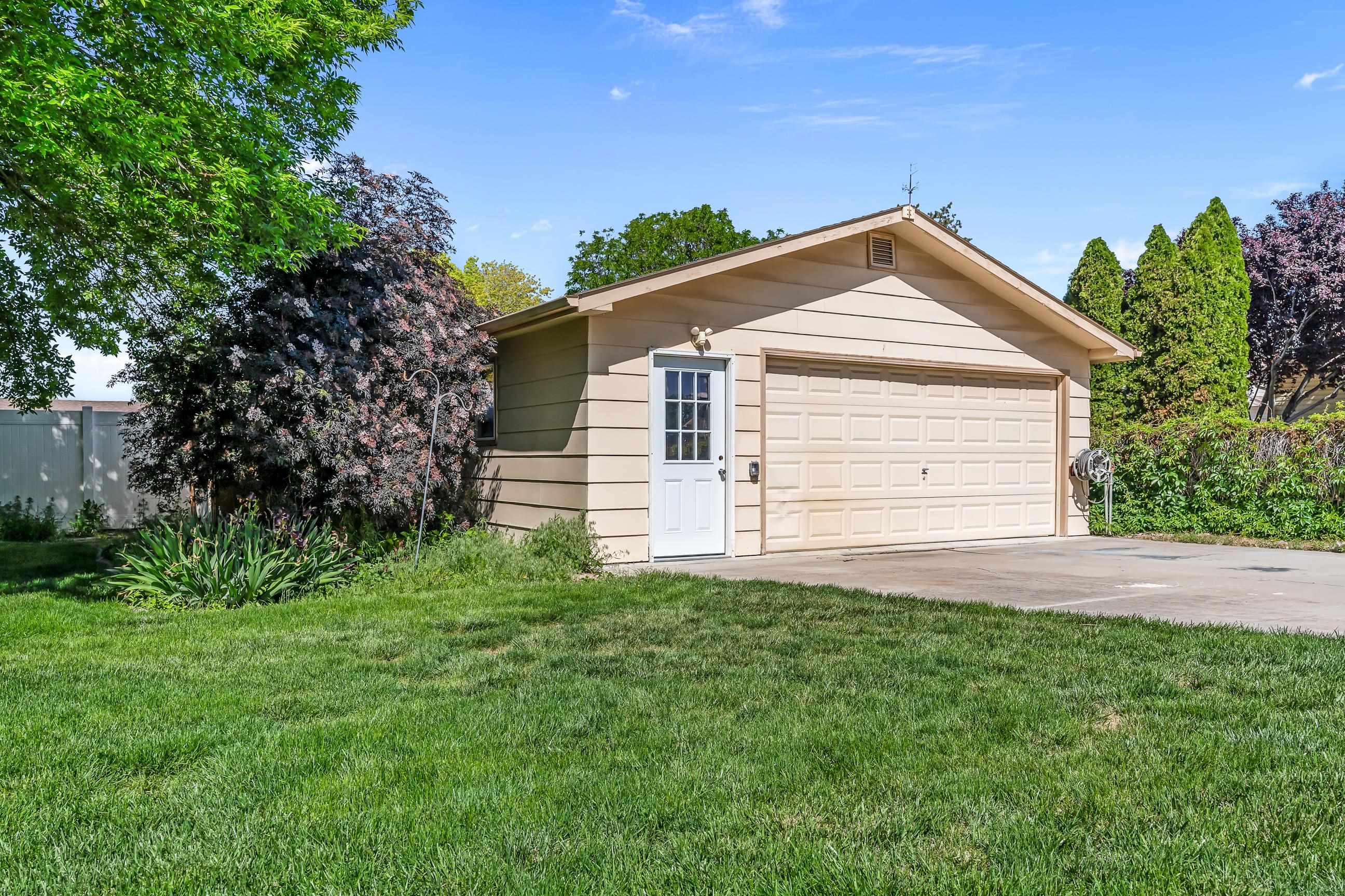 705-24 24 3/4 Road Grand Junction, CO 81505 - Photo 21 of 27 a front view of a house with a yard