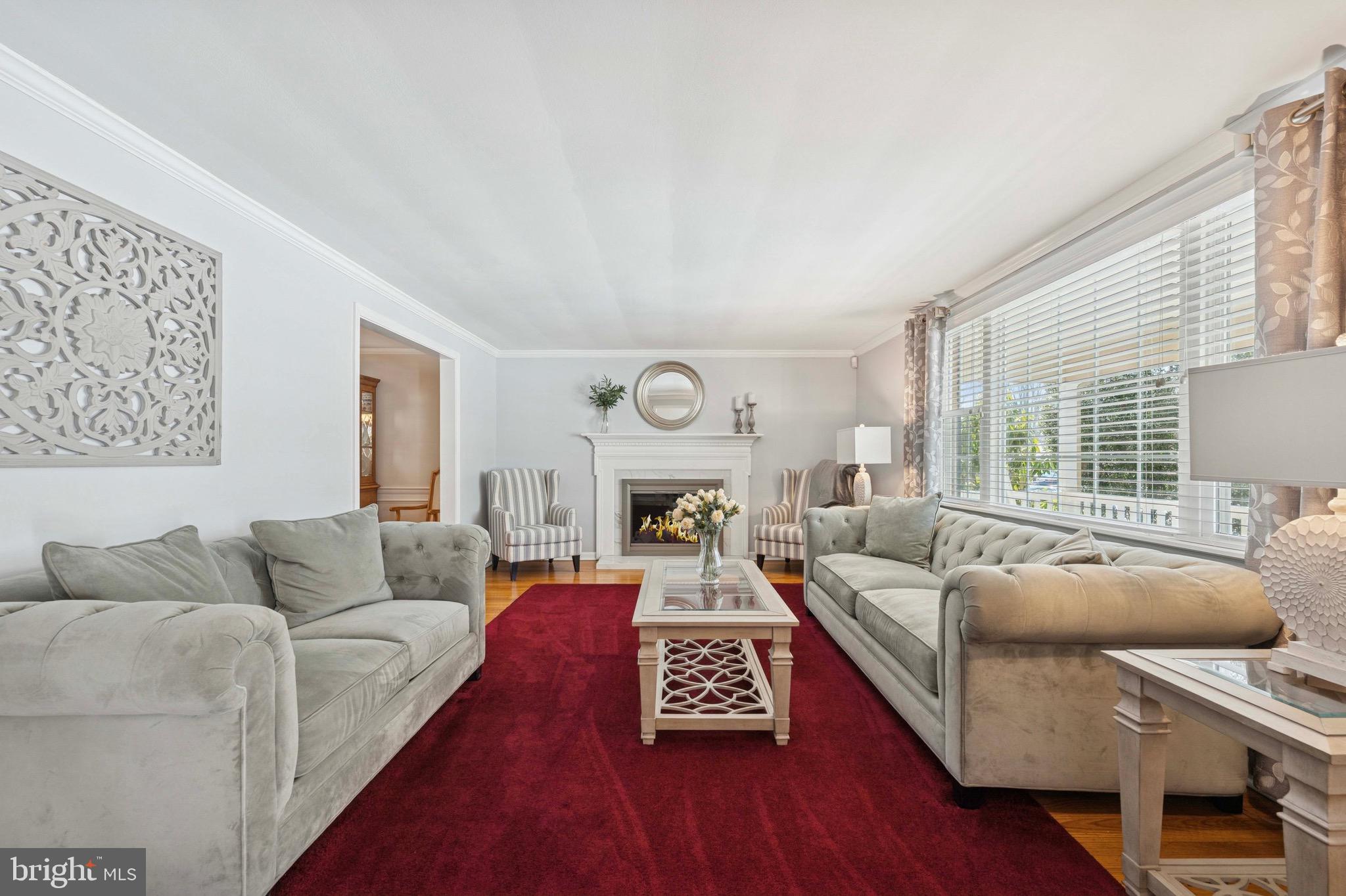 147 Snyder Lane Springfield, PA 19064 - Photo 4 of 42 Large living room with wood-burning fireplace.