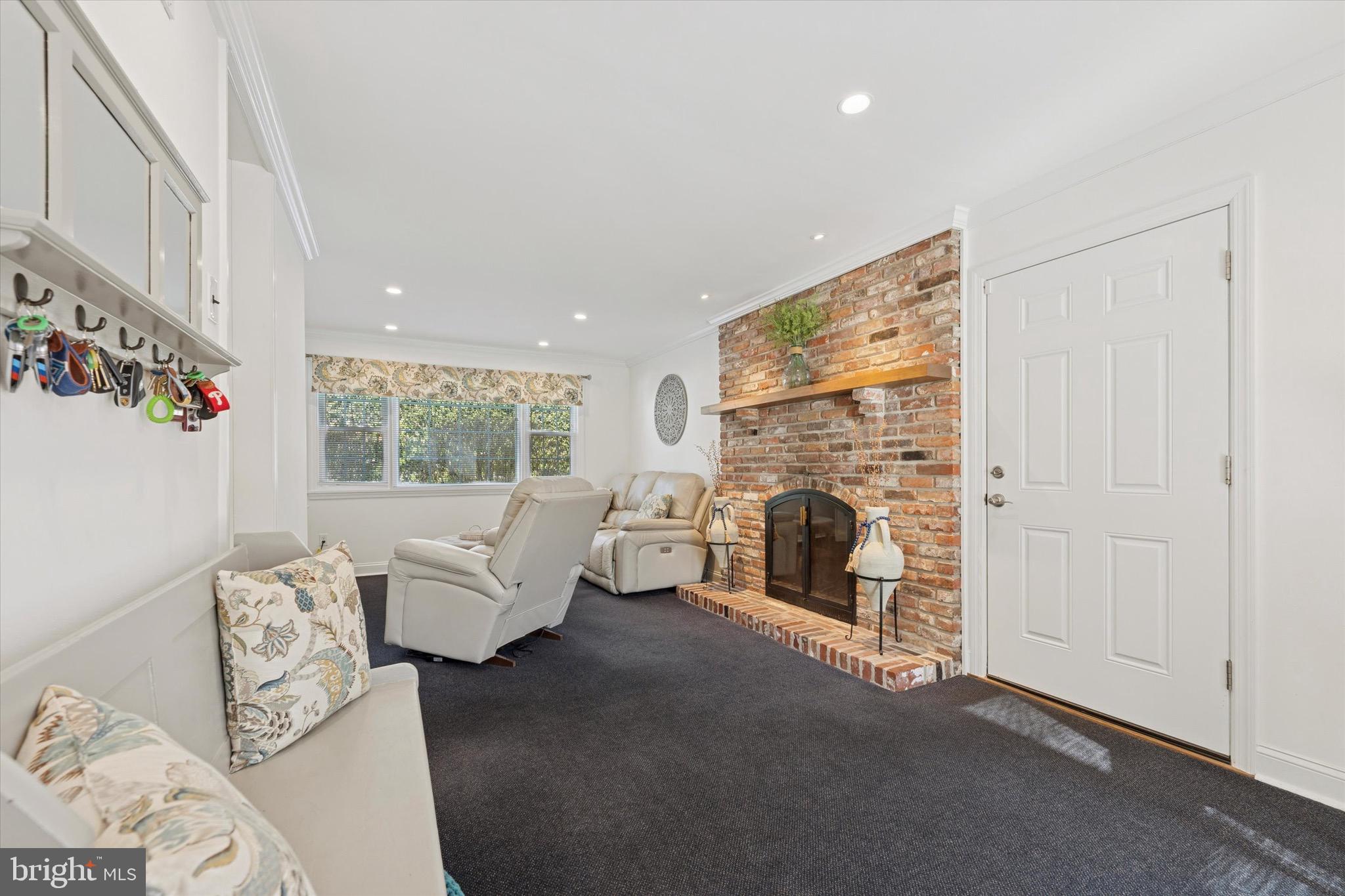 147 Snyder Lane Springfield, PA 19064 - Photo 10 of 42 Den with 2nd wood-burning fireplace.