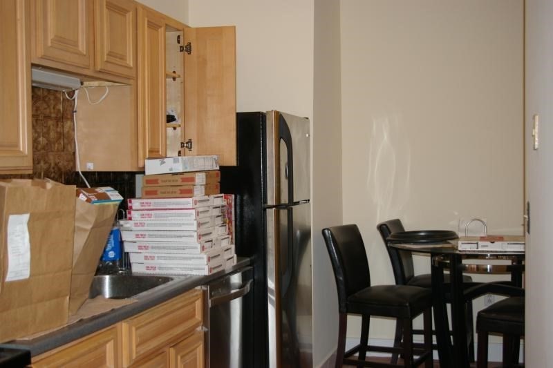 12 Ransom Road, Unit 6 Boston, MA 02135 - Photo 4 of 16 a view of a dining room with furniture