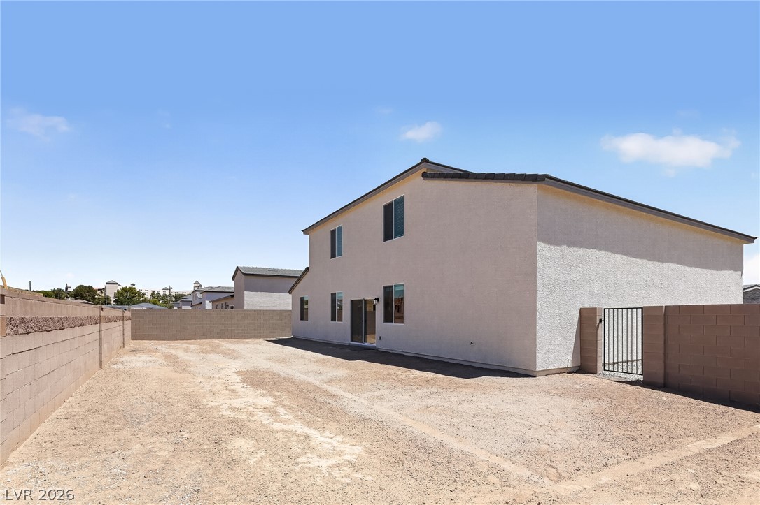 347 Sam Way Mesquite, NV 89027 - Photo 5 of 32 A newly constructed residence features an open, unlandscaped backyard with secure block fencing.
