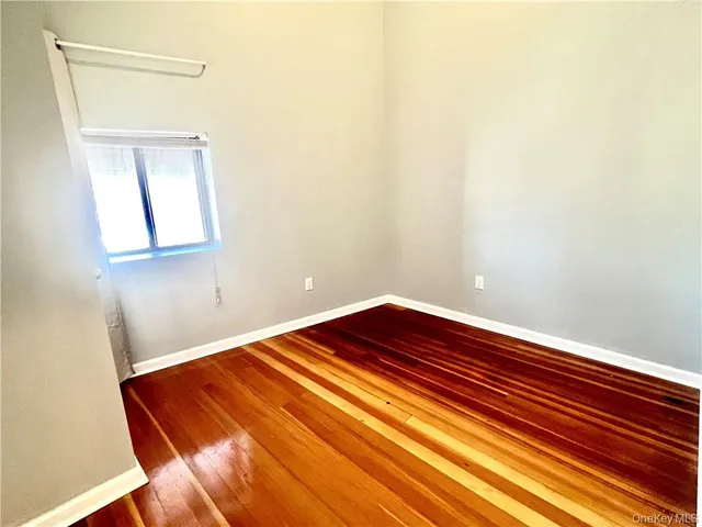 a view of a room with wooden floor and closet