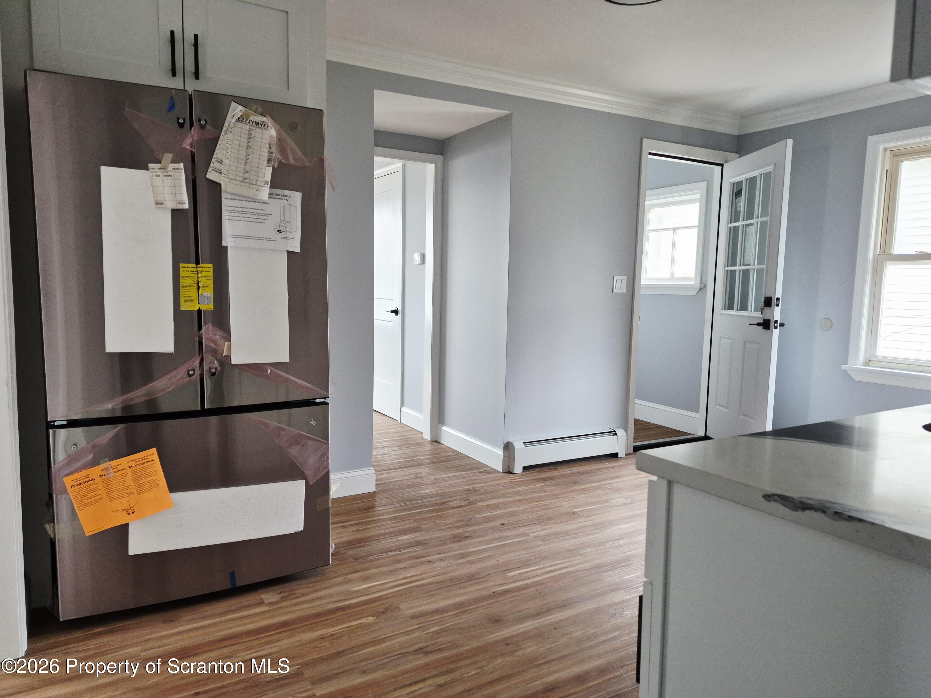 1132 Lloyd Street Scranton, PA 18508 - Photo 20 of 37 a view of living room with a wooden floor and a window