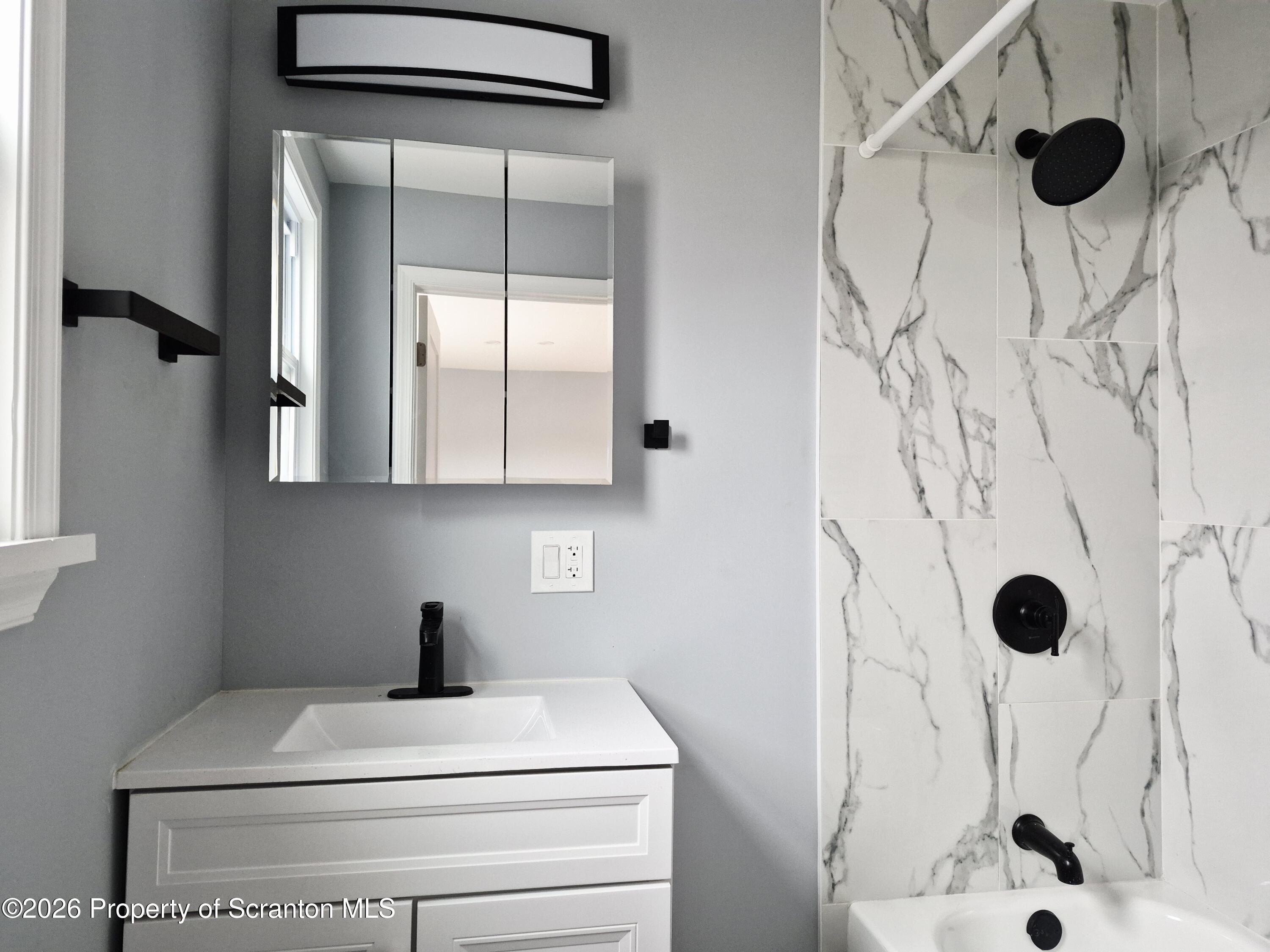 1132 Lloyd Street Scranton, PA 18508 - Photo 24 of 37 a bathroom with a sink and a shower