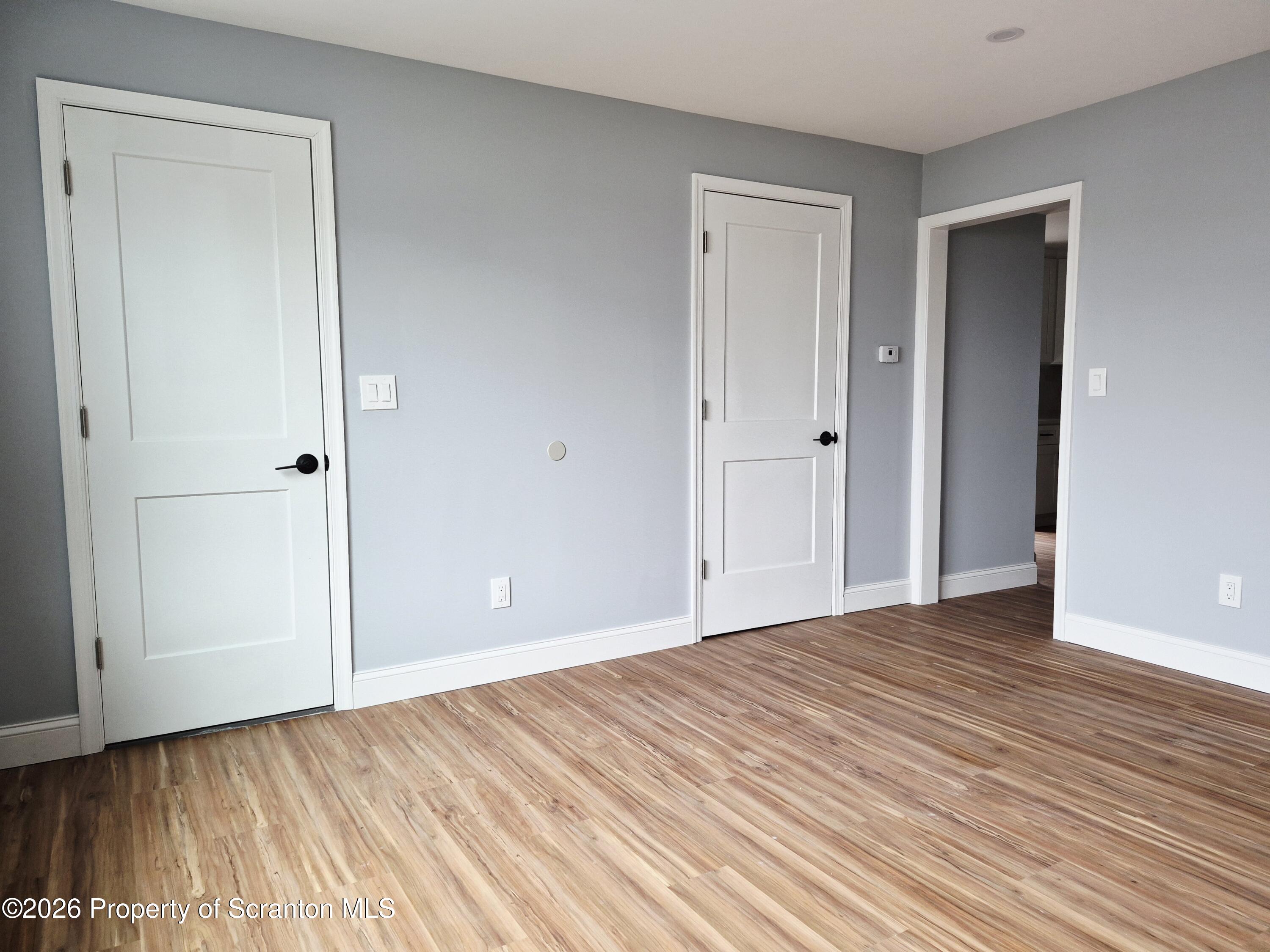1132 Lloyd Street Scranton, PA 18508 - Photo 27 of 37 a view of an empty room and wooden floor