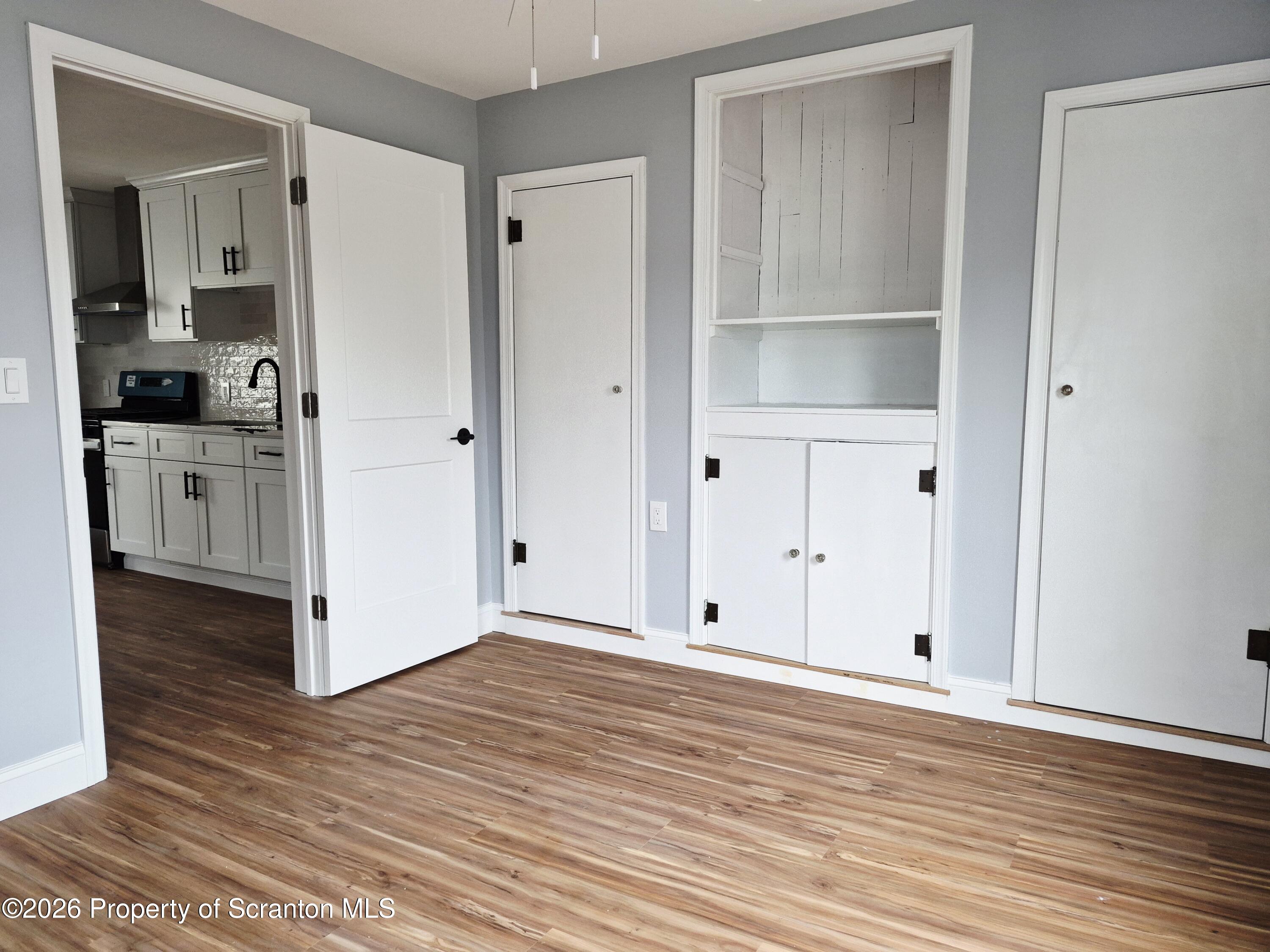 1132 Lloyd Street Scranton, PA 18508 - Photo 28 of 37 a view of an empty room with wooden floor and closet