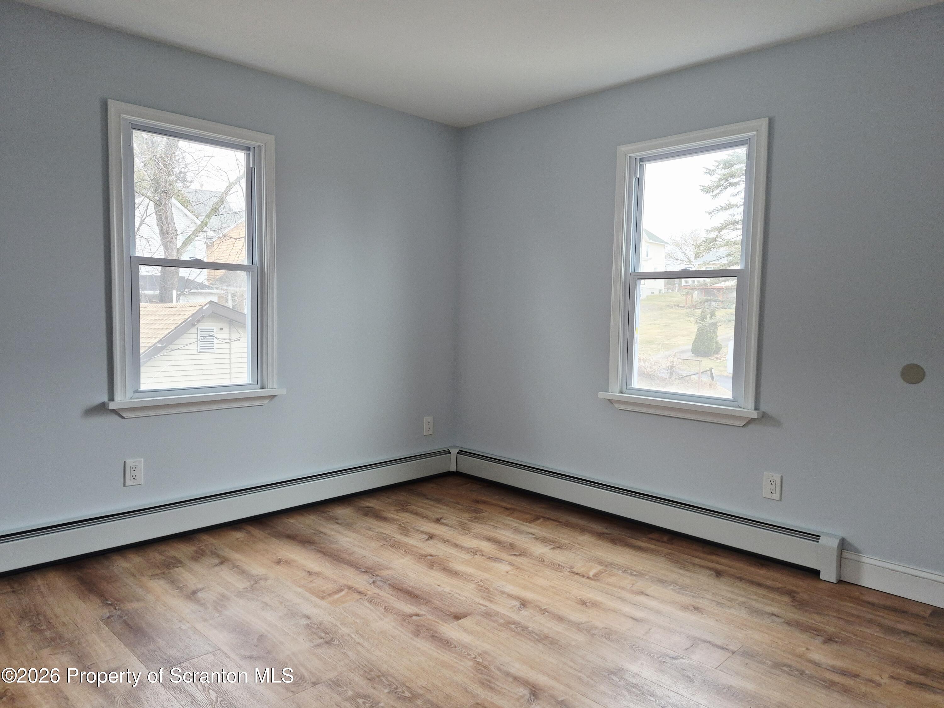 1132 Lloyd Street Scranton, PA 18508 - Photo 30 of 37 a view of an empty room with wooden floor and a window
