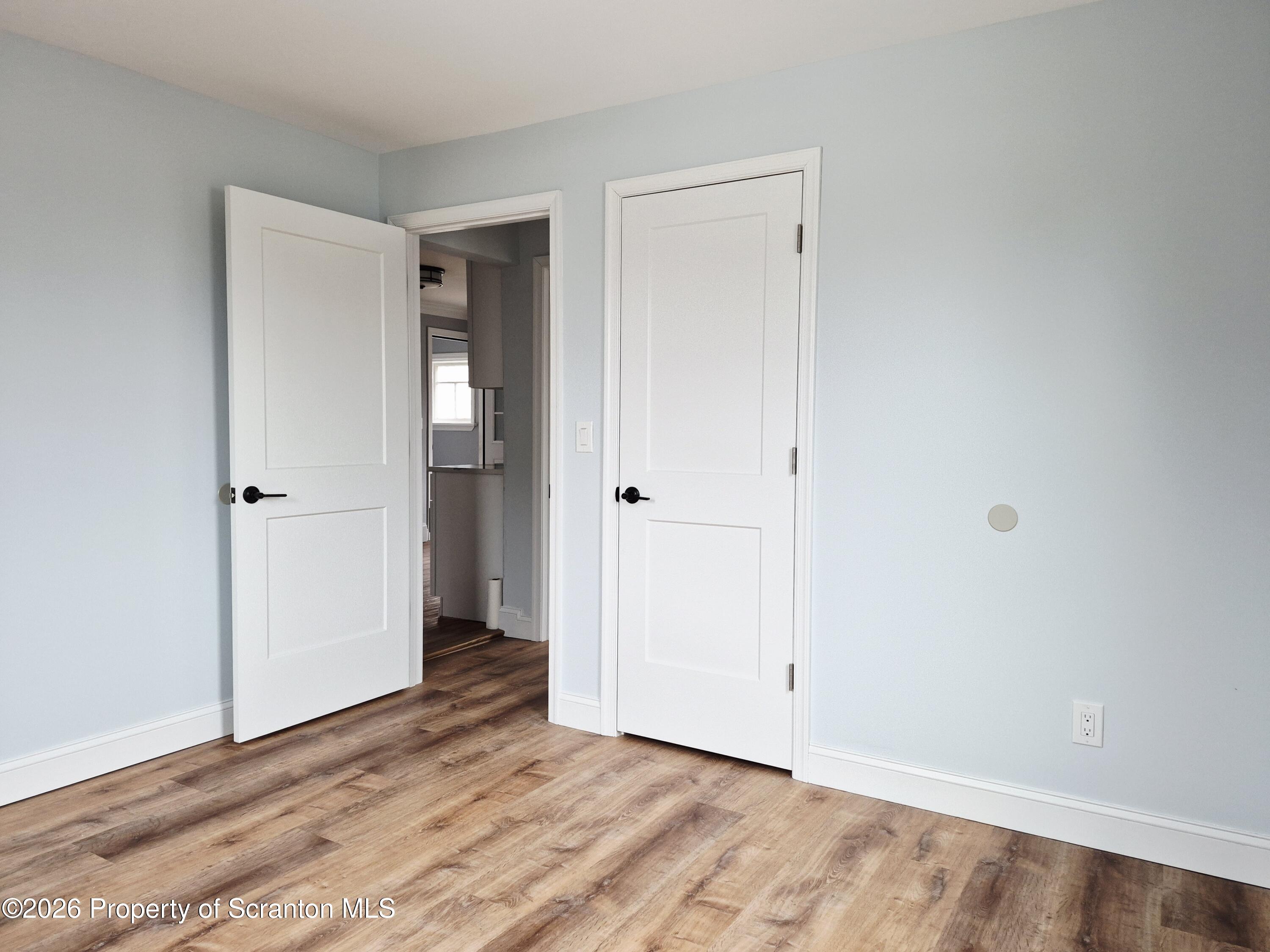 1132 Lloyd Street Scranton, PA 18508 - Photo 31 of 37 a view of an empty room with wooden floor
