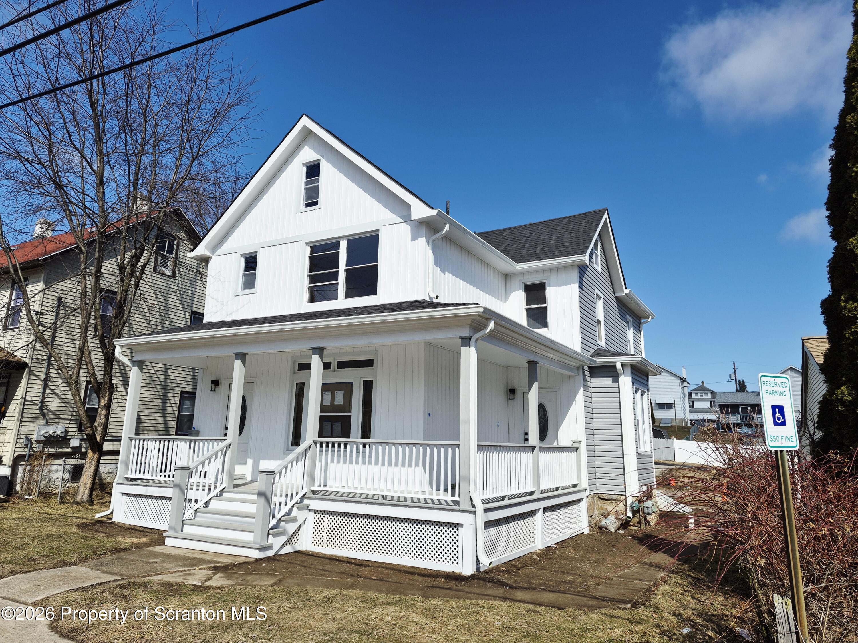 1132 Lloyd Street Scranton, PA 18508 - Photo 4 of 37 a front view of a house with a yard
