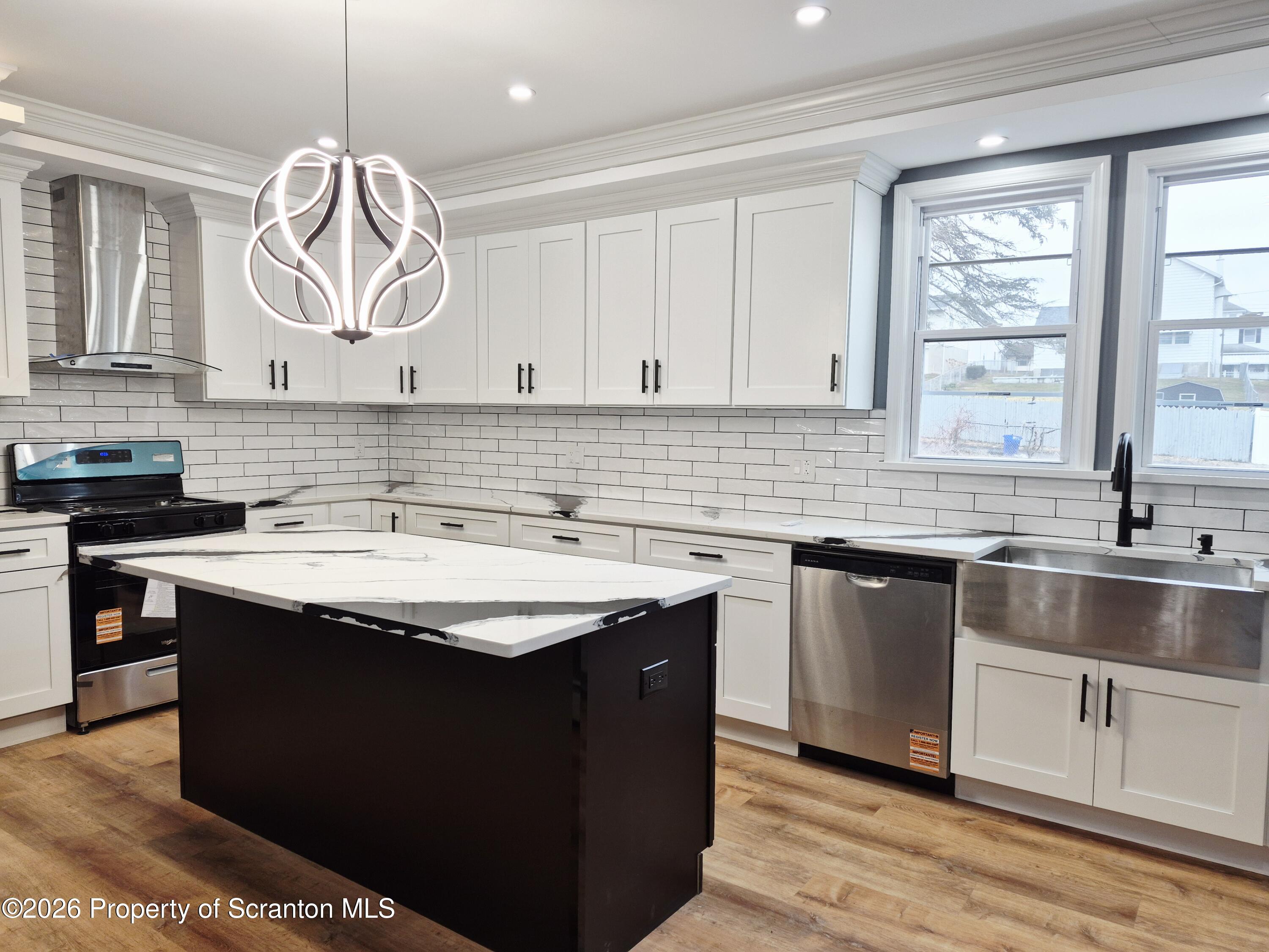 1132 Lloyd Street Scranton, PA 18508 - Photo 8 of 37 a kitchen with a sink cabinets and window