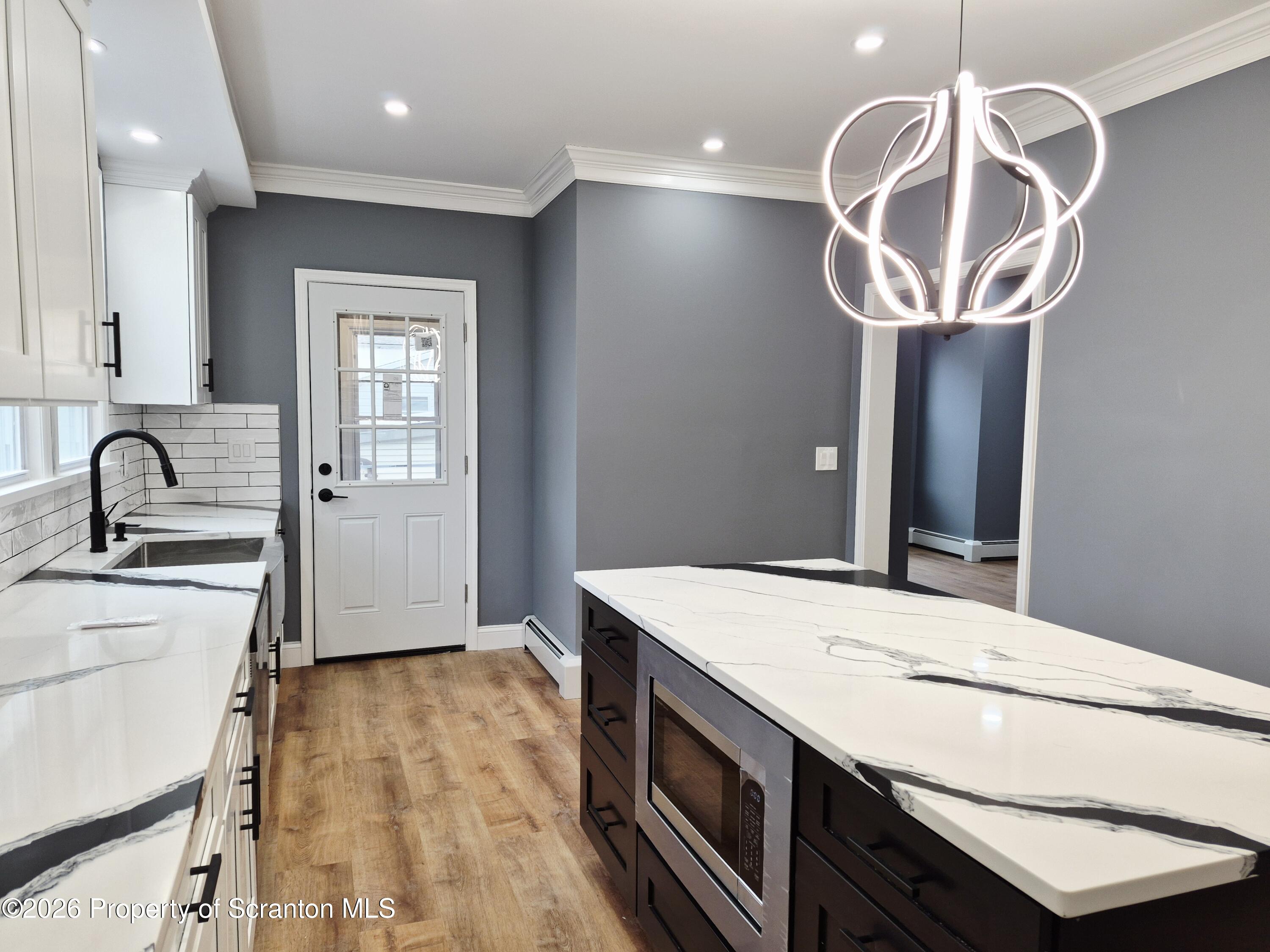 1132 Lloyd Street Scranton, PA 18508 - Photo 9 of 37 a kitchen with a sink cabinets and window