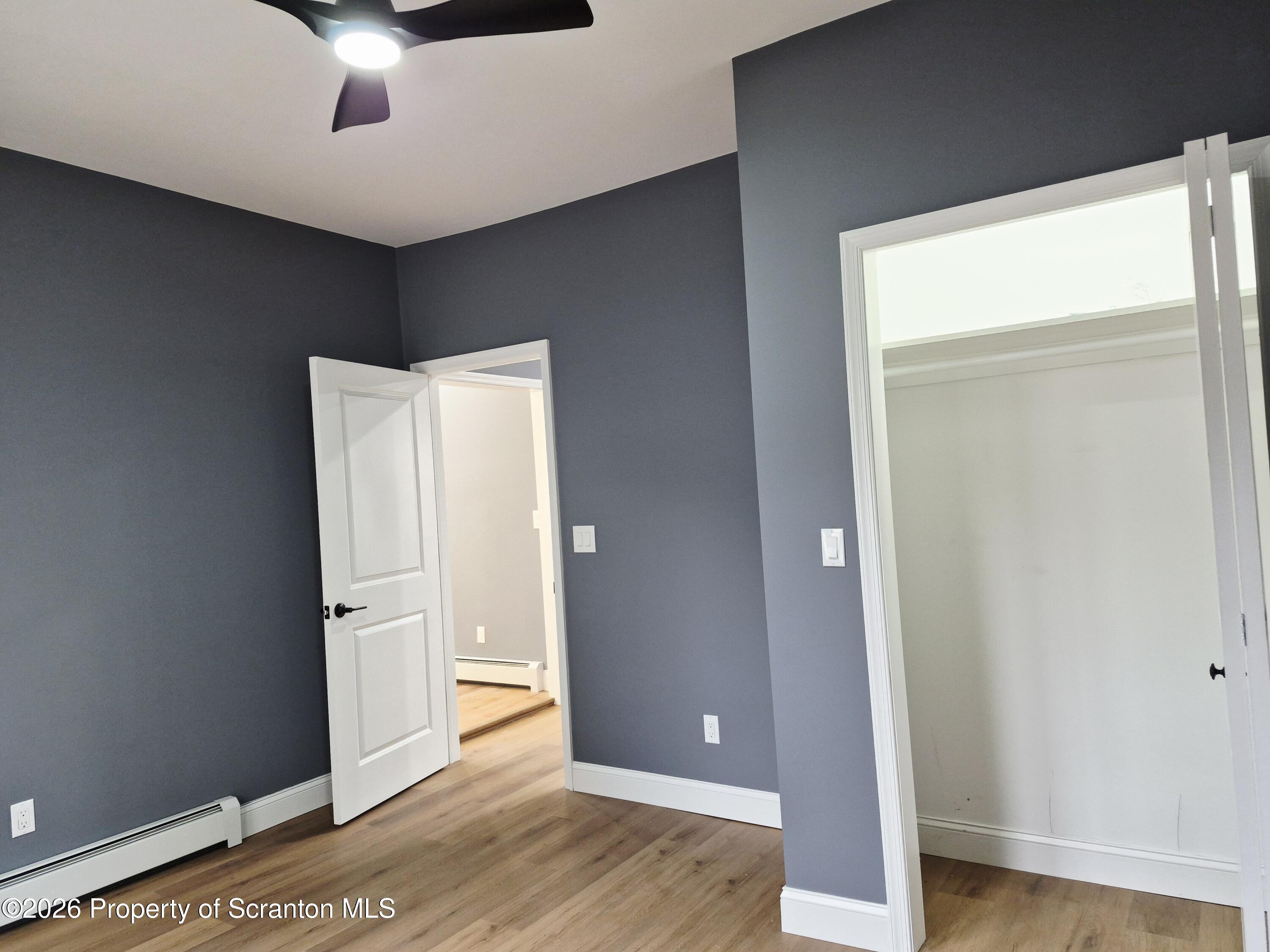 1132 Lloyd Street Scranton, PA 18508 - Photo 10 of 37 a view of a livingroom with wooden floor and cabinet