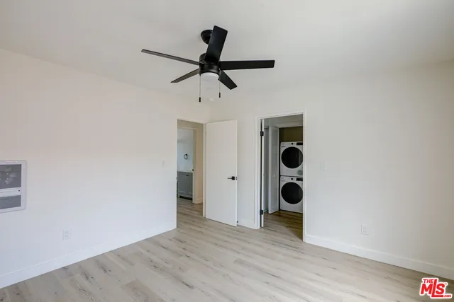 a view of a ceiling fan and wooden floor