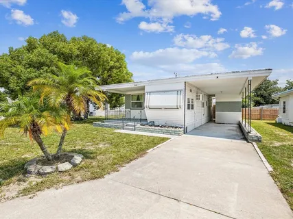 a view of a backyard of the house