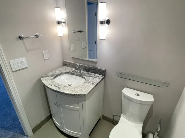 a bath tub sitting next to a shower