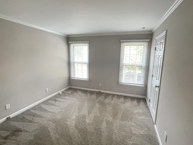 a bathroom with a granite countertop sink and a bathtub