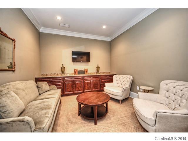 2100 Queens Road West, Unit 2128 Charlotte, NC 28207 - Photo 8 of 8 a living room with furniture and a flat screen tv