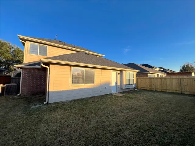 a view of a backyard of the house