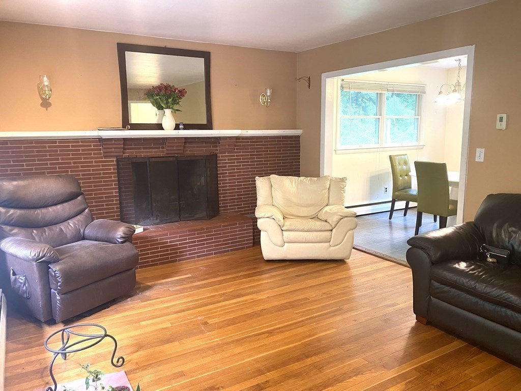 29 Hazen Road Shirley, MA 01464 - Photo 5 of 31 a living room with furniture and a wooden floor