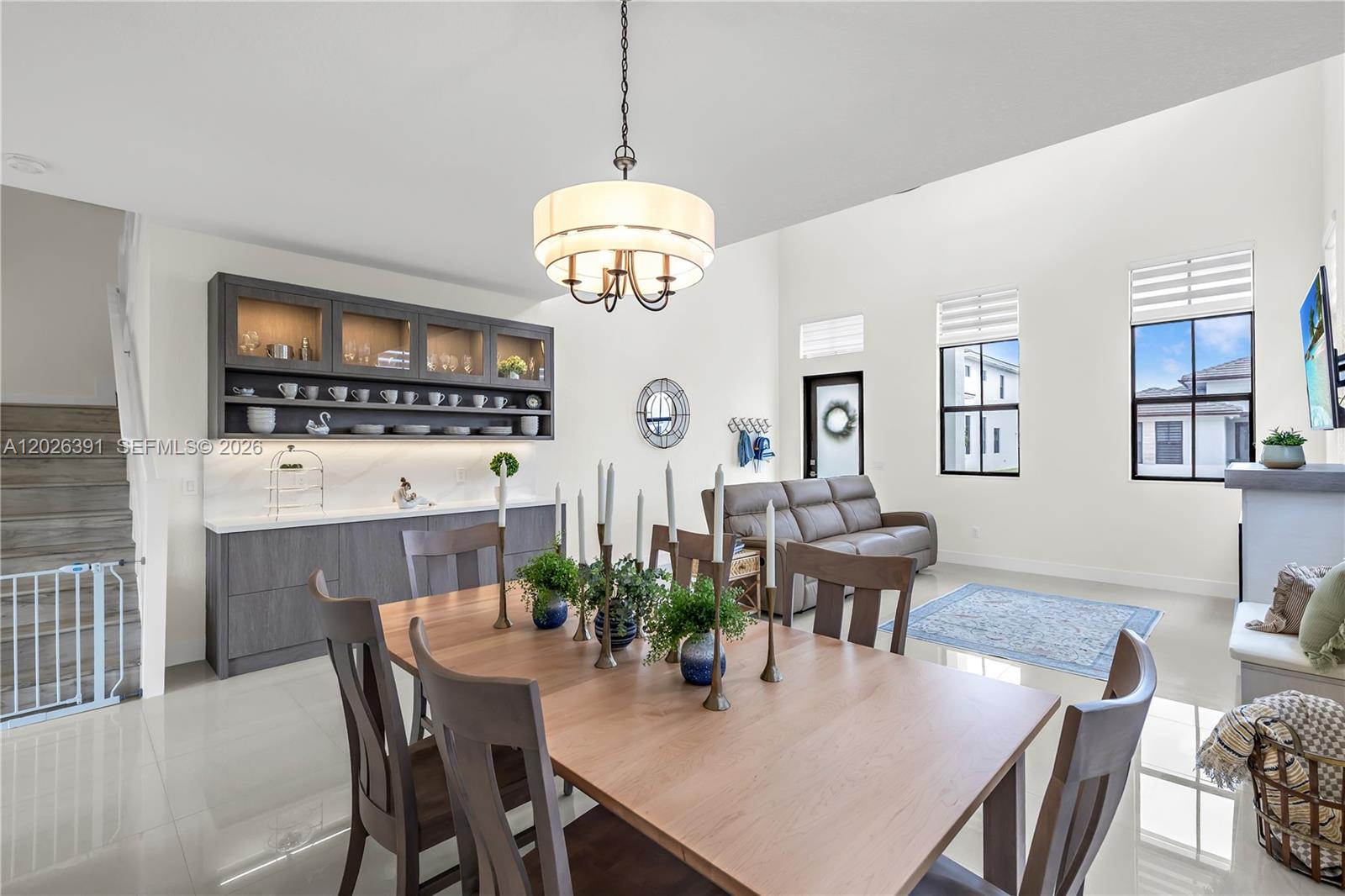 14606 Southwest 22nd Terrace Miami, FL 33175 - Photo 11 of 43 a view of a dining room with furniture a chandelier and wooden floor