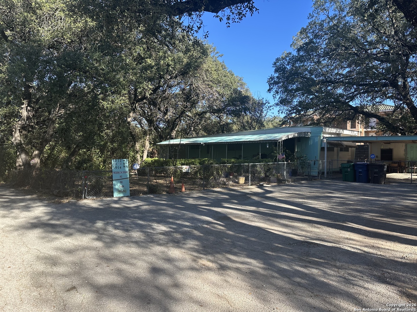 7912 Fredericksburg Road, Unit 3 San Antonio, TX 78229 - Photo 3 of 6 a view of a house with a yard and sitting area