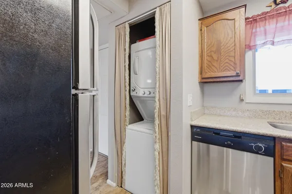 a view of walk in closet and bathroom