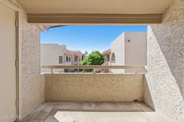 a view of a living room with a fireplace and a rug
