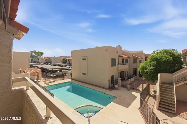 a view of a swimming pool with a lounge chair