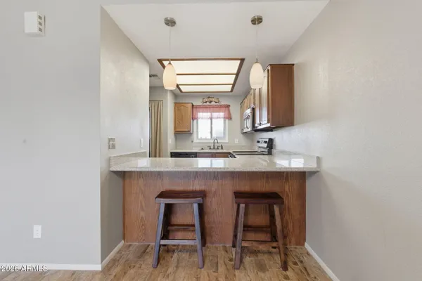 a view of a kitchen with a sink and a window