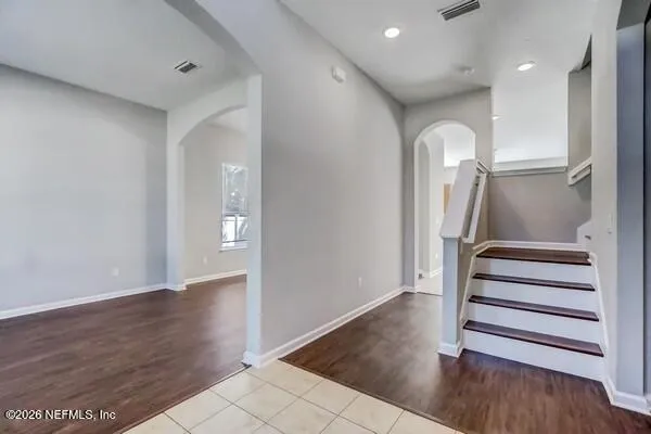 wooden floor in an empty room with a mirror