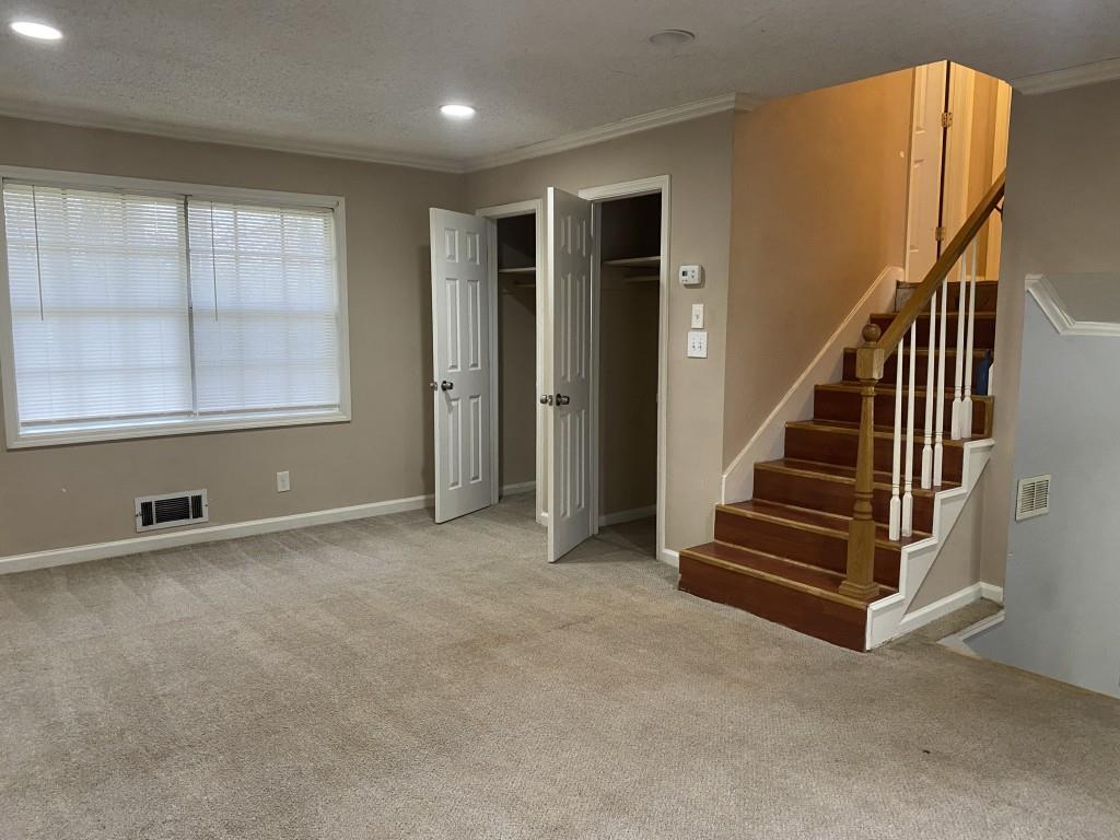 2340 Big Pine Court Conley, GA 30288 - Photo 6 of 25 an empty room with wooden floor and windows