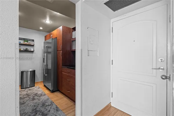 a bedroom with a bed dresser and a window