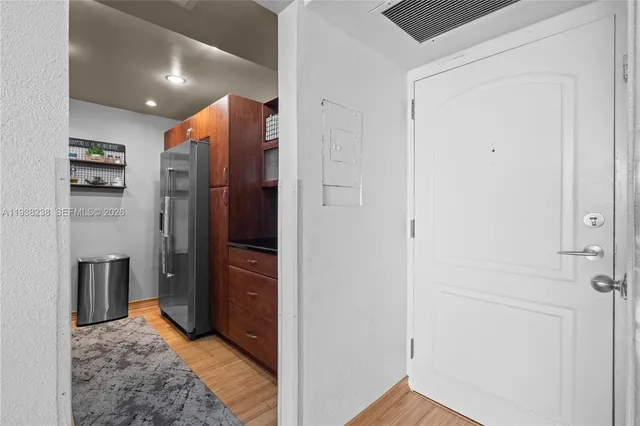 a bedroom with a bed dresser and a window