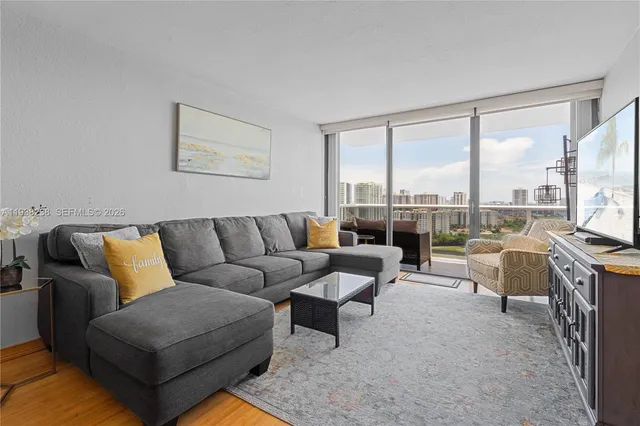 a living room with furniture and a large window