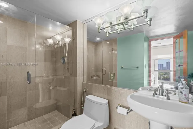 a view of a patio with a table and chairs under an umbrella