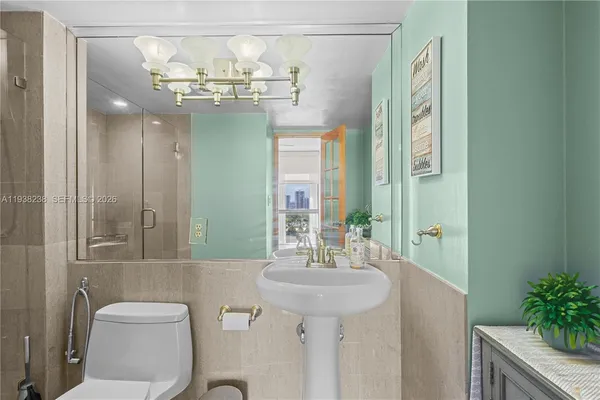 a living room with furniture and a book shelf