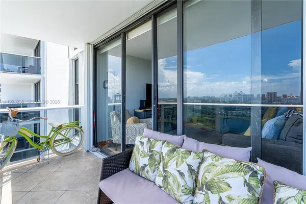 a room with pool table and wooden floor