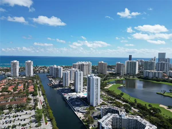 an empty room with wooden floor and a window