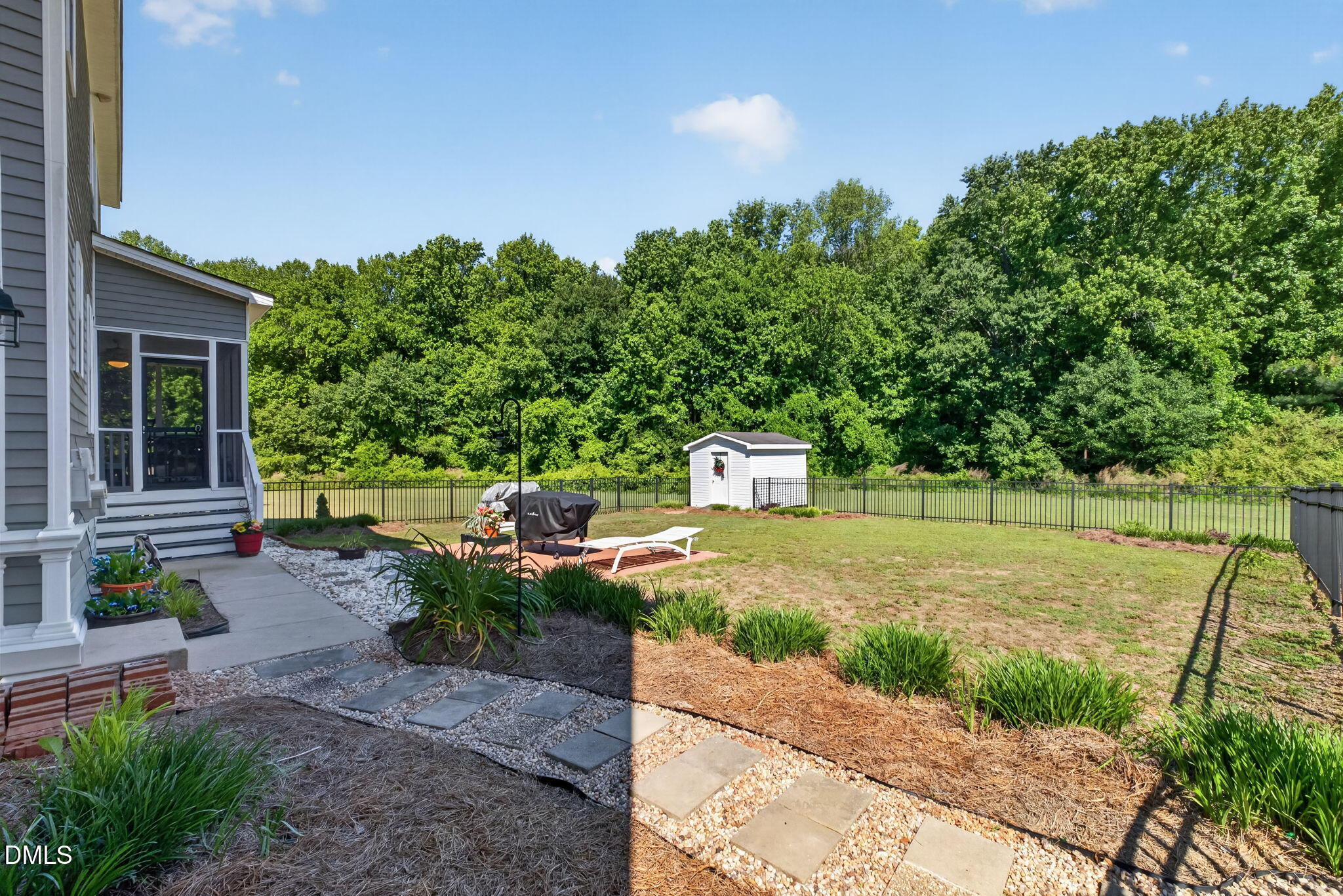 923 White Memorial Church Road Willow Spring, NC 27592 - Photo 34 of 46 a backyard of a house with table and chairs