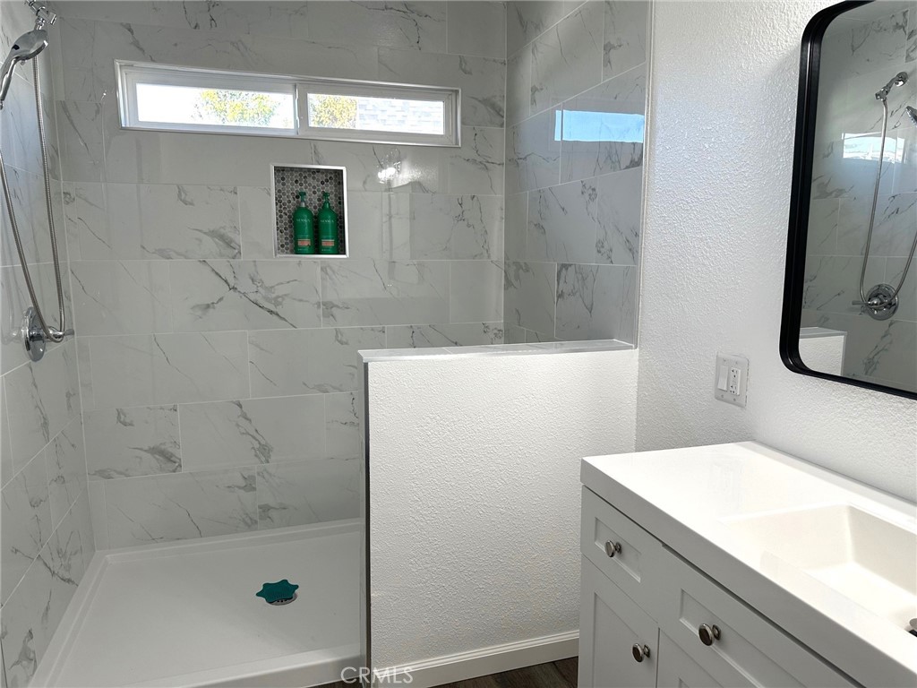 15181 Van Buren Boulevard, Unit 57 Riverside, CA 92504 - Photo 19 of 40 a bathroom with a bathtub and a sink