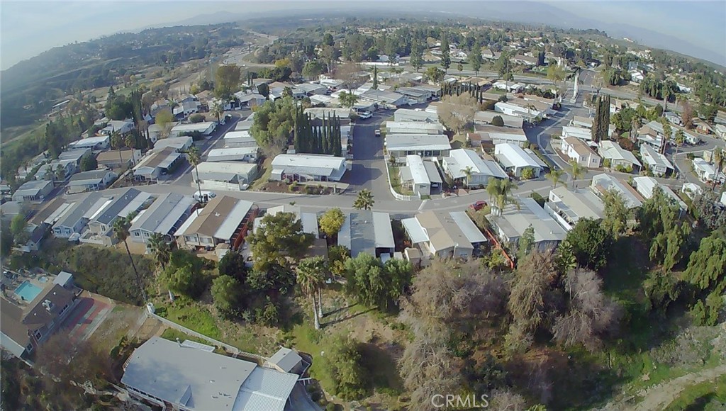 15181 Van Buren Boulevard, Unit 57 Riverside, CA 92504 - Photo 23 of 40 an aerial view of residential houses with outdoor space