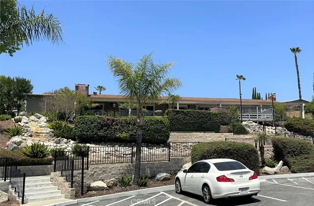 a view of a livingroom with furniture window and wooden floor