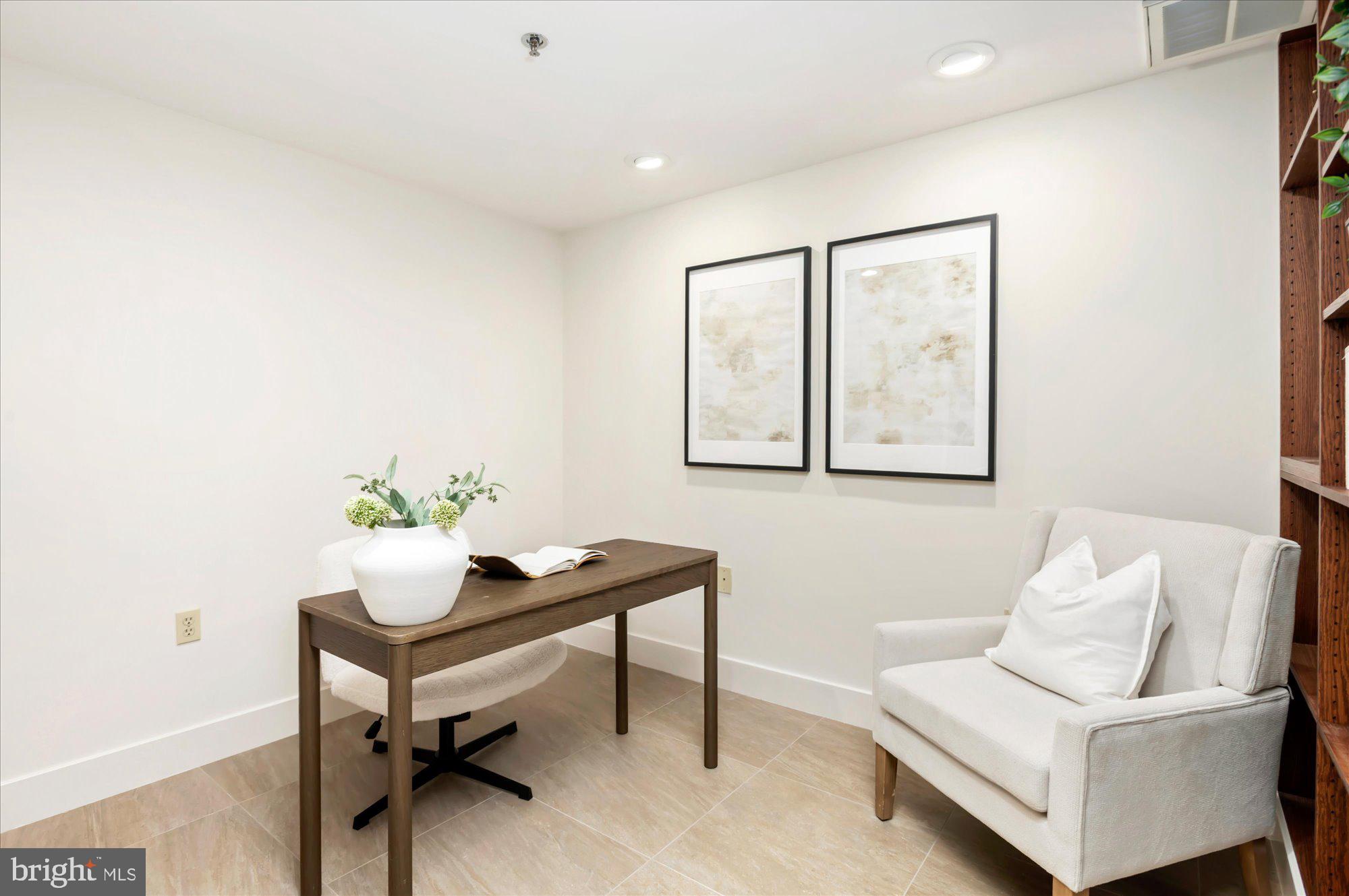 1913 Kalorama Place Northwest, Unit 13 Washington, DC 20009 - Photo 11 of 33 a living room with furniture and a potted plant