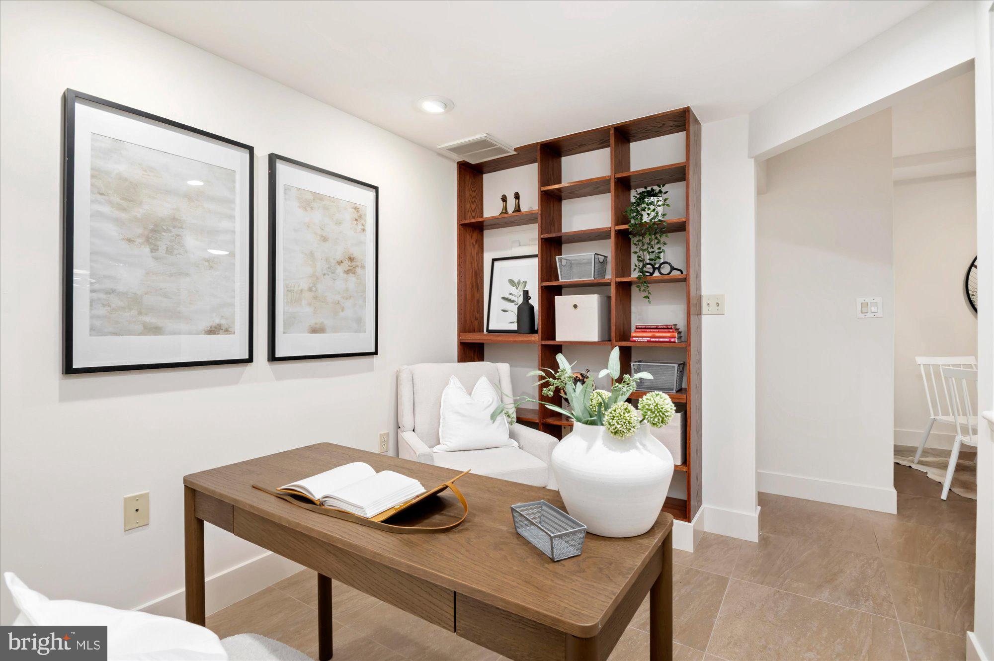 1913 Kalorama Place Northwest, Unit 13 Washington, DC 20009 - Photo 12 of 33 a living room with furniture and a window